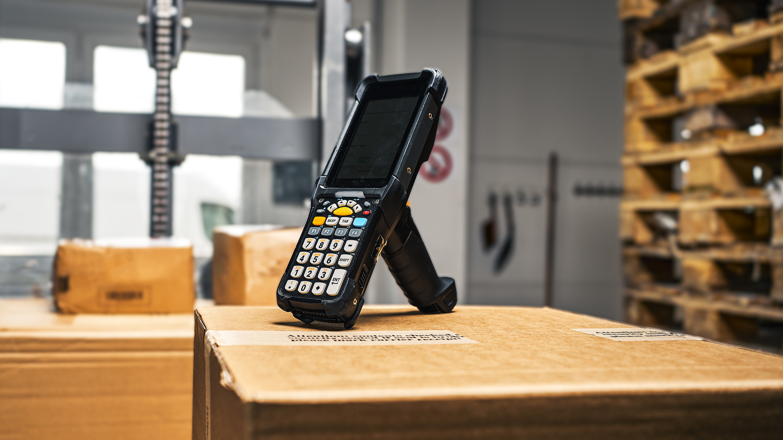 A scanner, which is used to capture data, stands on a pile of packed orders from our customers